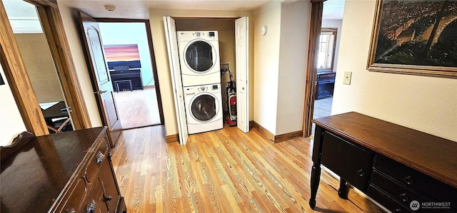 20354 Adrian Rd NE, Soap Lake, WA 98851 - washroom with estacked washer and dryer and light wood finished floors