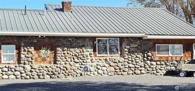 20354 Adrian Rd NE, Soap Lake, WA 98851 - view of property exterior with stone siding and a metal roof