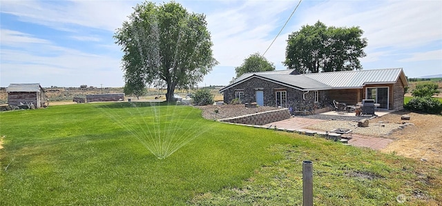 20354 Adrian Rd NE, Soap Lake, WA 98851 - view of grassy yard featuring a patio area