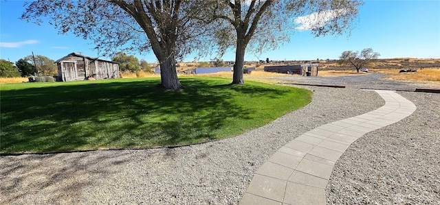 20354 Adrian Rd NE, Soap Lake, WA 98851 - view of green lawn featuring an outdoor structure