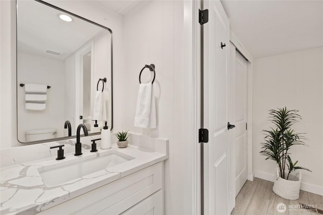 15409 Westshore Dr SE, Yelm, WA 98597 - bathroom with vanity, wood finished floors, and recessed lighting