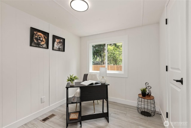 15409 Westshore Dr SE, Yelm, WA 98597 - home office with light wood-type flooring and a decorative wall