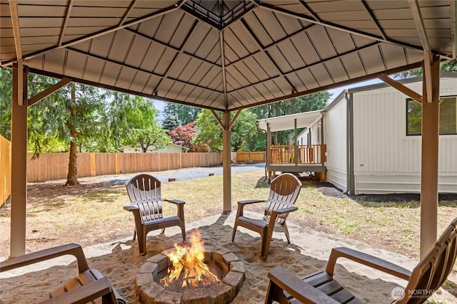 15409 Westshore Dr SE, Yelm, WA 98597 - fenced backyard with an outdoor fire pit and a patio area