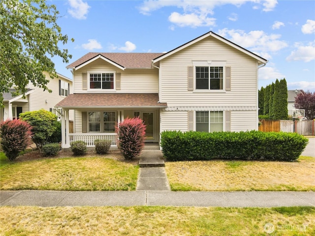 1662 Jensen Ave, Dupont, WA 98327 - traditional home featuring a porch and roof with shingles