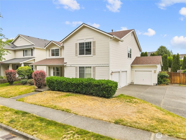 1662 Jensen Ave, Dupont, WA 98327 - traditional-style home with concrete driveway, an attached garage, and roof with shingles