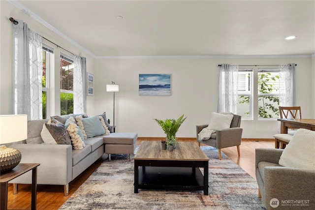 1662 Jensen Ave, Dupont, WA 98327 - living area featuring plenty of natural light, wood finished floors, crown molding, and recessed lighting