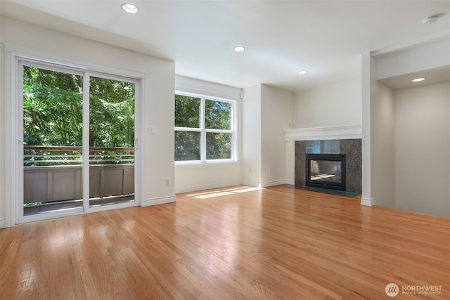 1426A NW 59th St, Seattle, WA 98107 - unfurnished living room featuring light wood finished floors, recessed lighting, and a tile fireplace