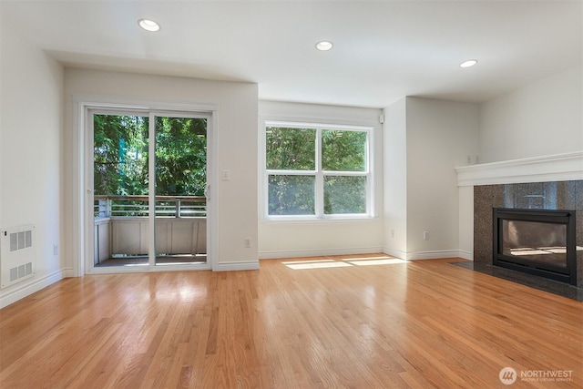 1426A NW 59th St, Seattle, WA 98107 - unfurnished living room featuring light wood-type flooring, recessed lighting, and a fireplace