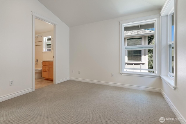 1426A NW 59th St, Seattle, WA 98107 - carpeted empty room with vaulted ceiling and baseboards