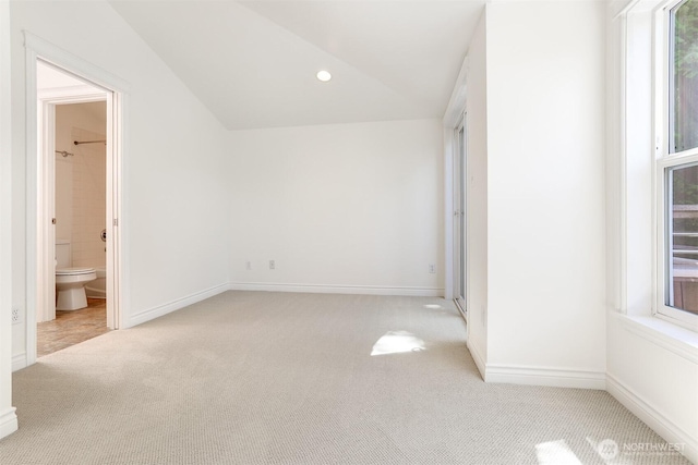 1426A NW 59th St, Seattle, WA 98107 - unfurnished bedroom with light colored carpet, multiple windows, recessed lighting, vaulted ceiling, and connected bathroom