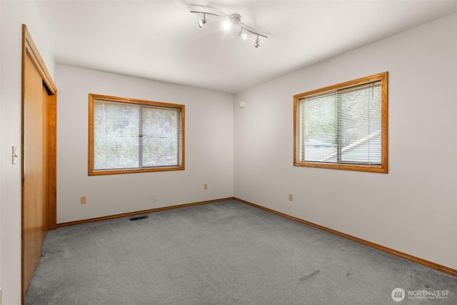 15526 SE 344th St, Auburn, WA 98092 - unfurnished bedroom with multiple windows, light carpet, and a closet