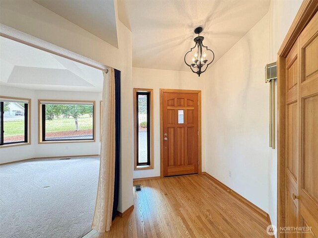 412 Doe Run Rd, Sequim, WA 98382 - entryway with healthy amount of natural light, a chandelier, and light wood finished floors