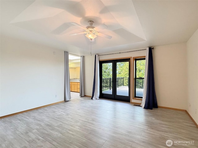 412 Doe Run Rd, Sequim, WA 98382 - spare room with light wood-style flooring and a ceiling fan