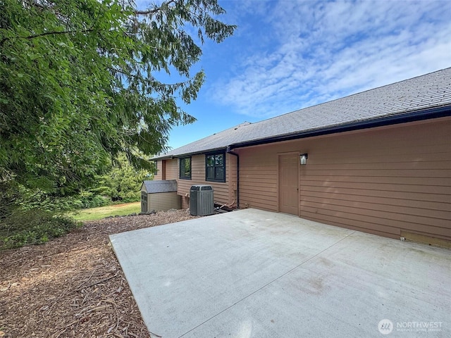 412 Doe Run Rd, Sequim, WA 98382 - back of house featuring a patio and a shed