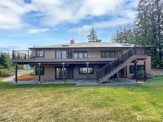 412 Doe Run Rd, Sequim, WA 98382 - back of house with a patio area, a wooden deck, a yard, and stairs