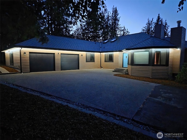 412 Doe Run Rd, Sequim, WA 98382 - single story home featuring driveway, a chimney, and an attached garage