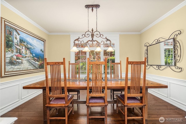 24817 NE 20th St, Sammamish, WA 98074 - dining area with wood finished floors, ornamental molding, a chandelier, a wainscoted wall, and a decorative wall