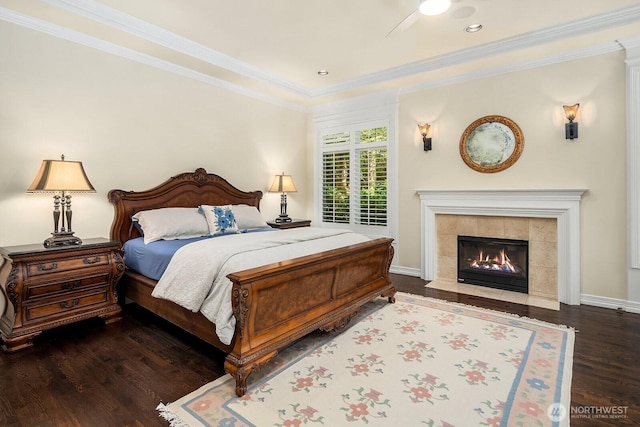 24817 NE 20th St, Sammamish, WA 98074 - bedroom with wood finished floors, crown molding, and a tiled fireplace