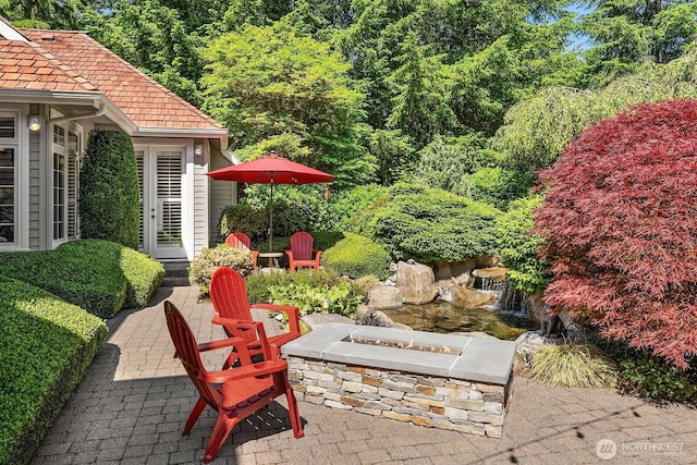 24817 NE 20th St, Sammamish, WA 98074 - view of patio / terrace featuring a fire pit