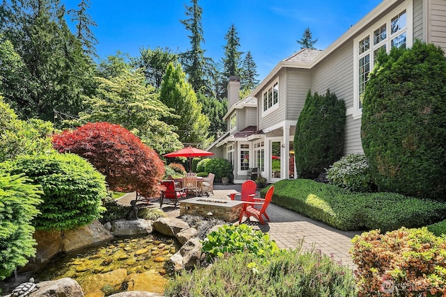 24817 NE 20th St, Sammamish, WA 98074 - view of patio / terrace featuring a fire pit