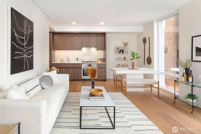 121 Stewart St Unit 1407, Seattle, WA 98101 - living area with light wood-style floors and recessed lighting