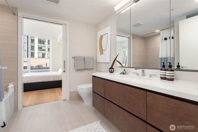 121 Stewart St Unit 1407, Seattle, WA 98101 - ensuite bathroom with vanity and curtained shower