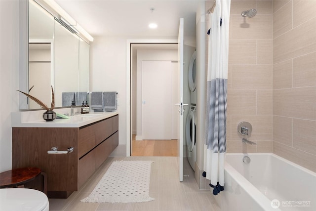 121 Stewart St Unit 1407, Seattle, WA 98101 - full bathroom with stacked washer / dryer, shower / tub combo with curtain, and vanity