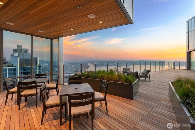 121 Stewart St Unit 1407, Seattle, WA 98101 - deck with a water view and outdoor dining space