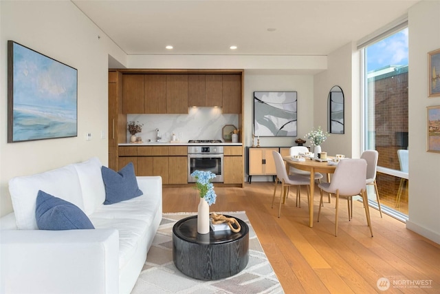 121 Stewart St Unit 1407, Seattle, WA 98101 - living area with light wood-type flooring and recessed lighting