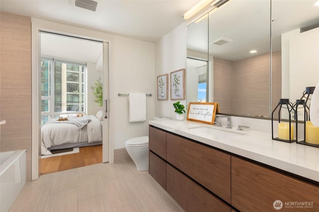 121 Stewart St Unit 1407, Seattle, WA 98101 - bathroom with vanity and a tub to relax in
