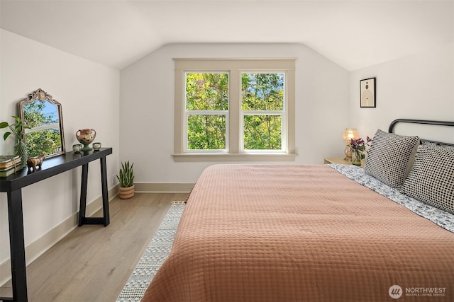 702 34th St, Everett, WA 98201 - bedroom with vaulted ceiling and light wood-style floors