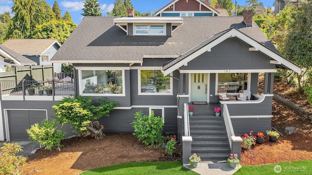 702 34th St, Everett, WA 98201 - view of front of home with a shingled roof, a chimney, covered porch, and an attached garage