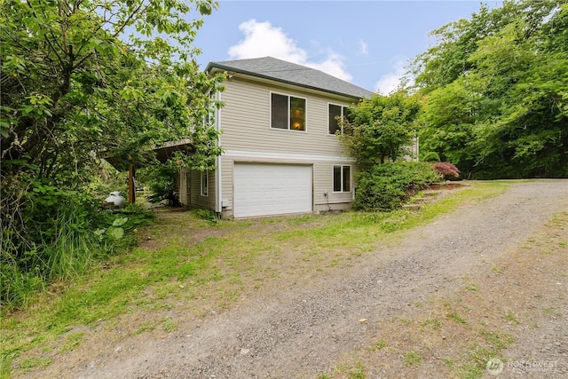 2595 Anderson Hill Rd SW, Port Orchard, WA 98367 - view of property exterior with dirt driveway and a garage