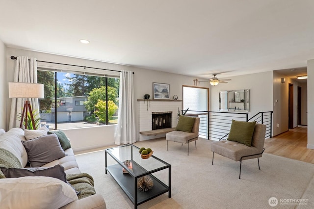 8815 221st Pl SW, Edmonds, WA 98026 - living room with a brick fireplace, a ceiling fan, and recessed lighting