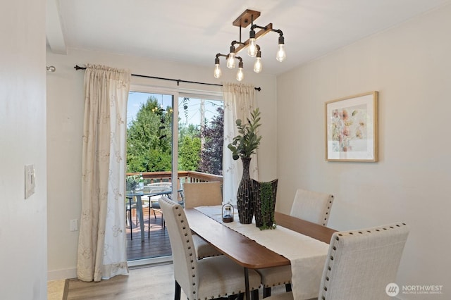8815 221st Pl SW, Edmonds, WA 98026 - dining area featuring light wood-style flooring and a chandelier