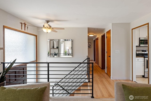 8815 221st Pl SW, Edmonds, WA 98026 - corridor featuring light wood finished floors and baseboards