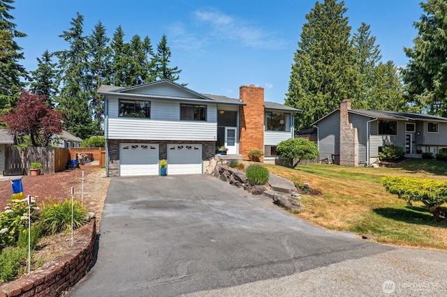 8815 221st Pl SW, Edmonds, WA 98026 - raised ranch featuring driveway and a garage