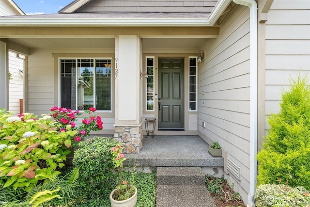 9127 Periwinkle Loop NE, Olympia, WA 98516 - doorway to property featuring a porch