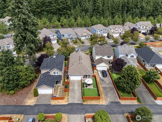 9127 Periwinkle Loop NE, Olympia, WA 98516 - aerial perspective of suburban area with a heavily wooded area