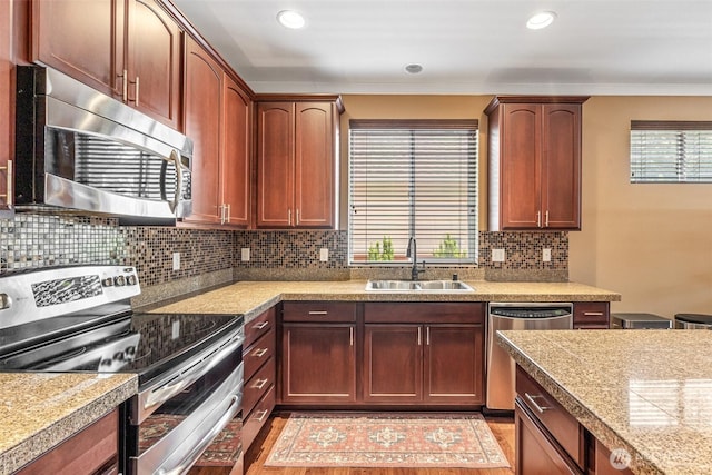 9127 Periwinkle Loop NE, Olympia, WA 98516 - kitchen with stainless steel appliances, healthy amount of natural light, backsplash, tile countertops, and crown molding