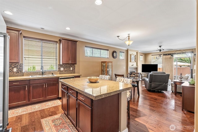 9127 Periwinkle Loop NE, Olympia, WA 98516 - kitchen with tile countertops, ceiling fan, a kitchen breakfast bar, backsplash, and recessed lighting
