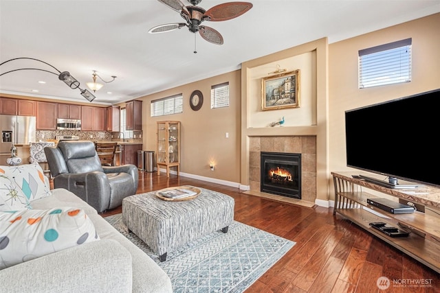 9127 Periwinkle Loop NE, Olympia, WA 98516 - living area with a ceiling fan, dark wood finished floors, a tile fireplace, and recessed lighting