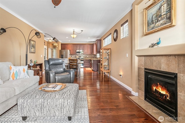 9127 Periwinkle Loop NE, Olympia, WA 98516 - living area with a fireplace, dark wood-style floors, and crown molding