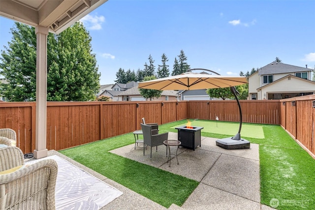 9127 Periwinkle Loop NE, Olympia, WA 98516 - fenced backyard featuring a patio area and a fire pit
