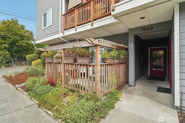 7000 Cleopatra Pl NW Unit 303, Seattle, WA 98117 - entrance to property featuring a pergola and a balcony