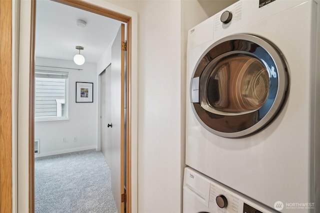 7000 Cleopatra Pl NW Unit 303, Seattle, WA 98117 - washroom featuring stacked washer / dryer and carpet flooring