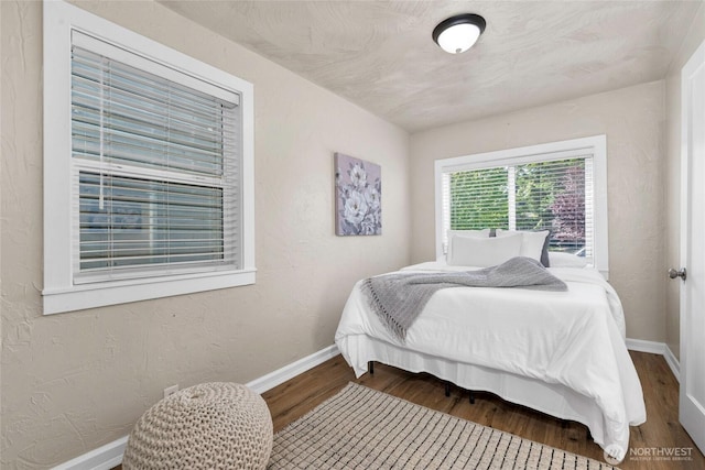 3109 N 7th St, Tacoma, WA 98406 - bedroom with baseboards and wood finished floors
