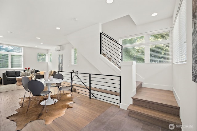1513 Lakeview Blvd E, Seattle, WA 98102 - stairway featuring wood finished floors, recessed lighting, and a wall mounted air conditioner