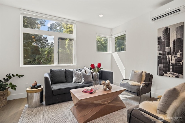 1513 Lakeview Blvd E, Seattle, WA 98102 - living area featuring an AC wall unit and wood finished floors
