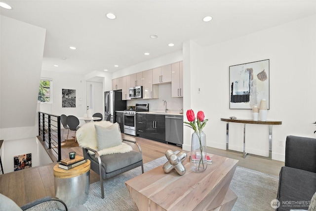 1513 Lakeview Blvd E, Seattle, WA 98102 - living room featuring light wood-style floors and recessed lighting